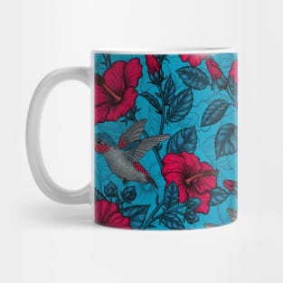 Red hibiscus and hummingbirds, tropical garden on light blue Mug